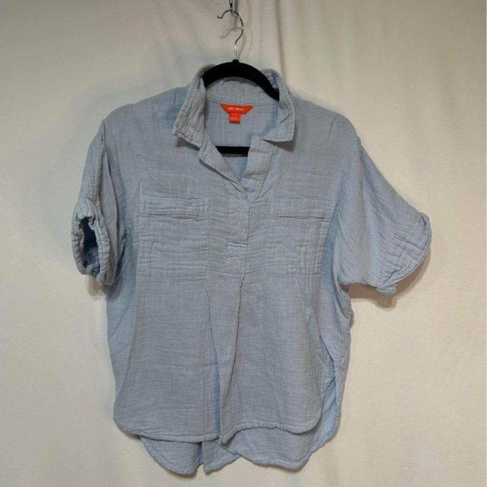 Woman’s muslin style collared shirt. Size medium. Light blue. Relaxed fit.